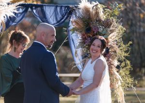 bride and groom at the alter in autumn wedding Hanmer Springs