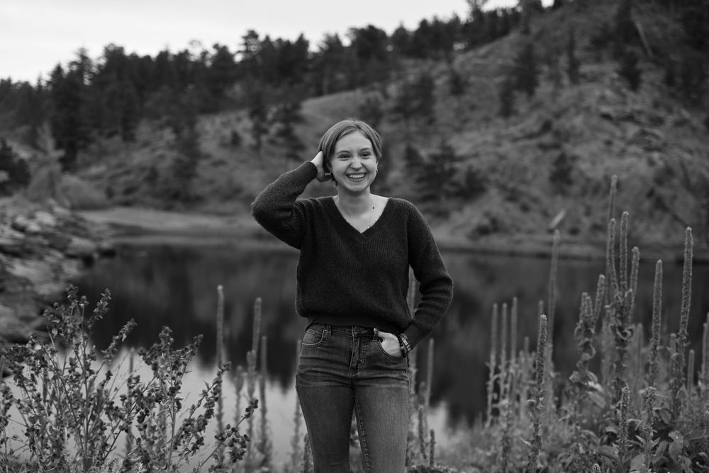 Outdoor lifestyle photography session near a mountain lake during golden hour.