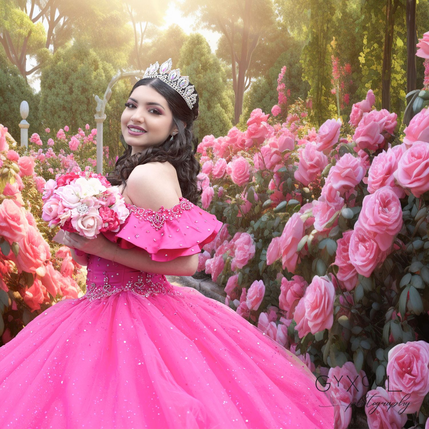 Elegant pink ballgown photographed in a garden setting surrounded by blooming pink roses.