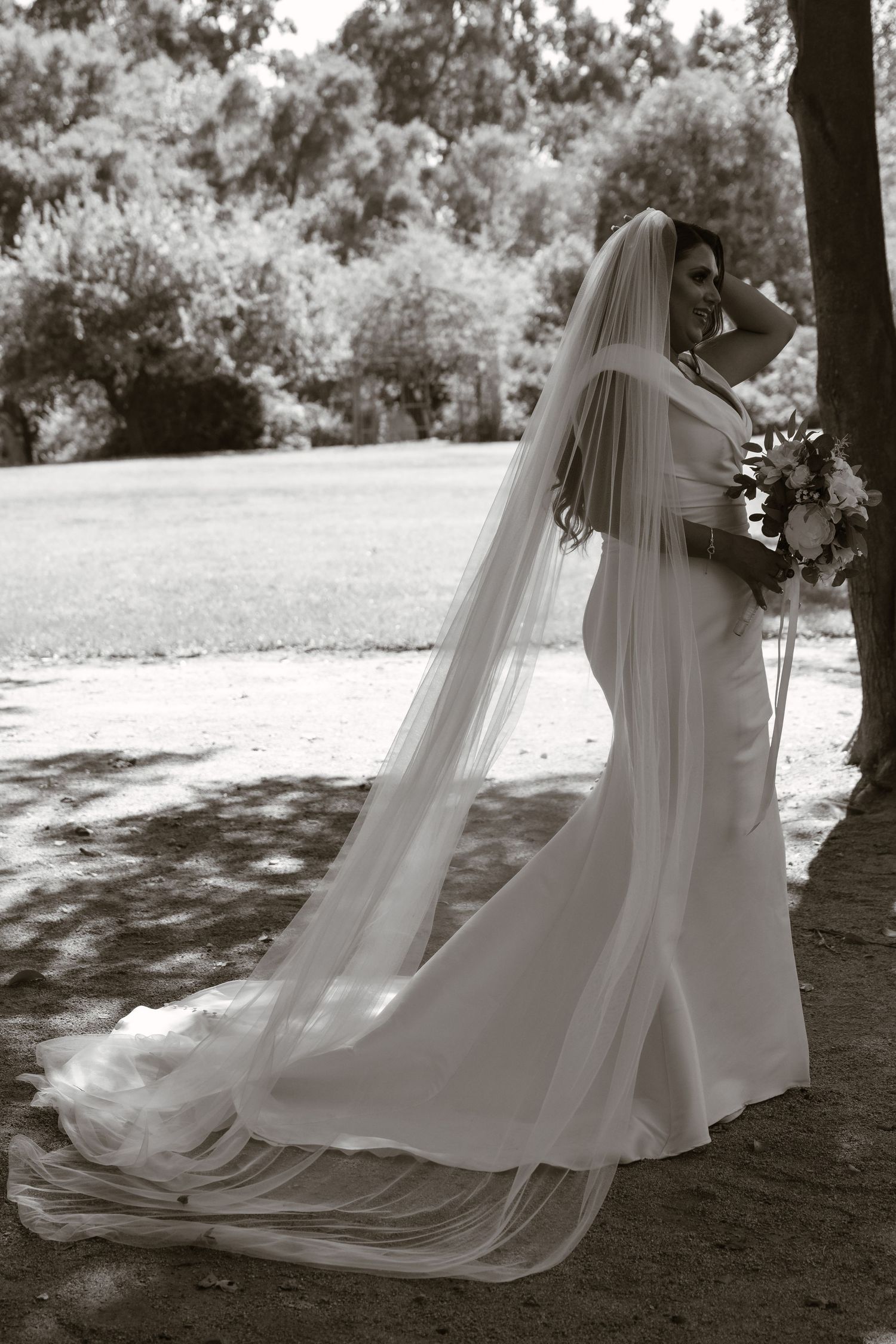 Series of flowing white wedding dress shots in a dreamy outdoor setting.