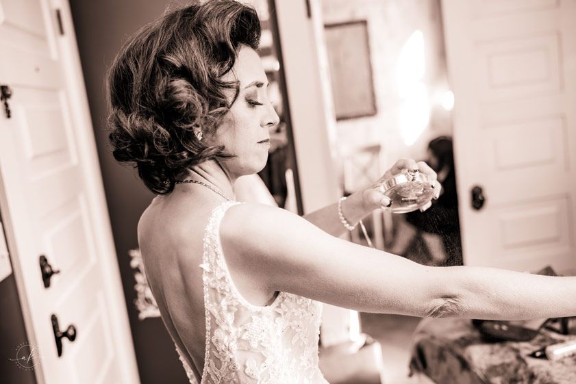 A vintage-styled bridal preparation scene with lace dress details.
