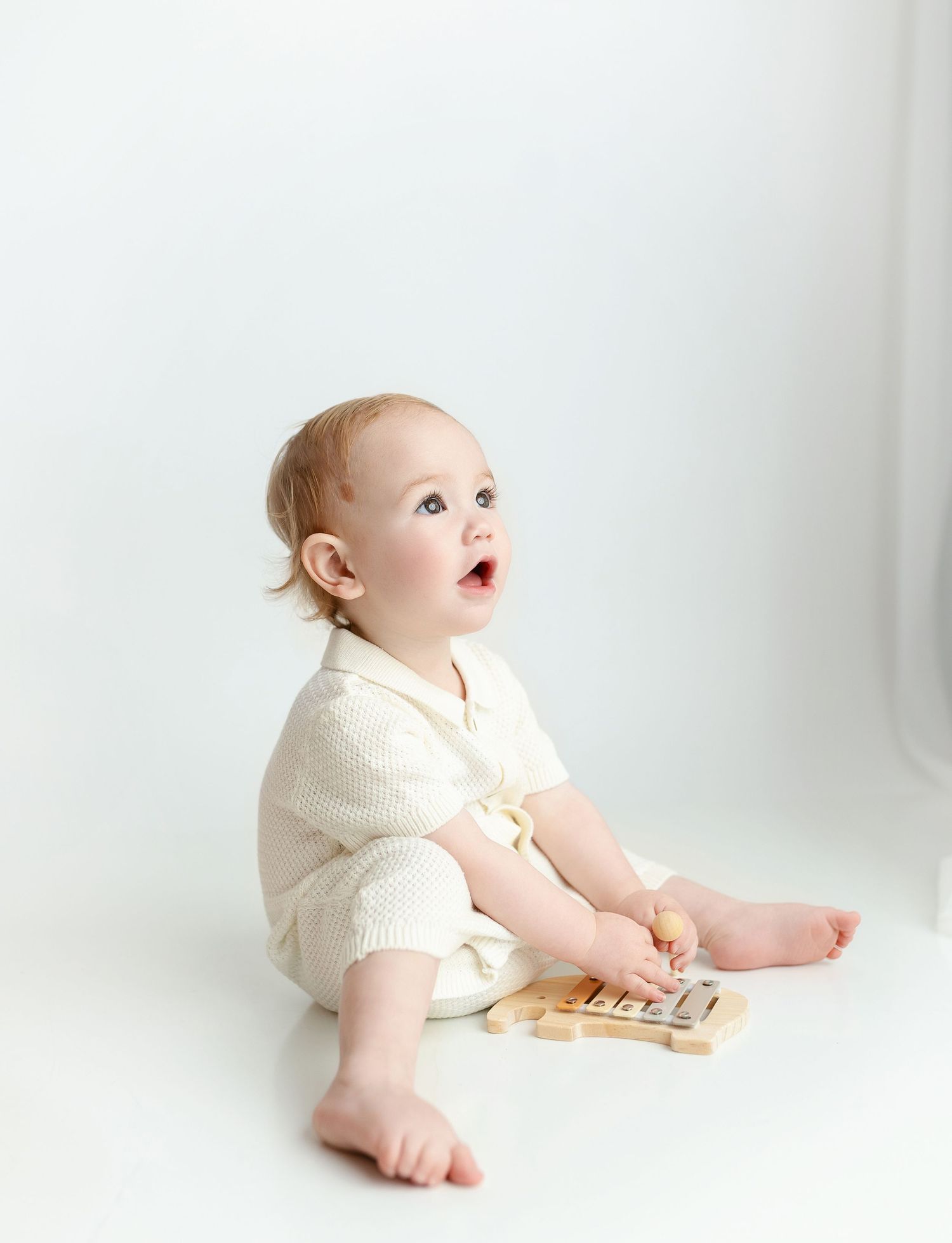 A little boy looking up to the light. Greenville SC milestone Photographer, Easley, SC newborn photographer