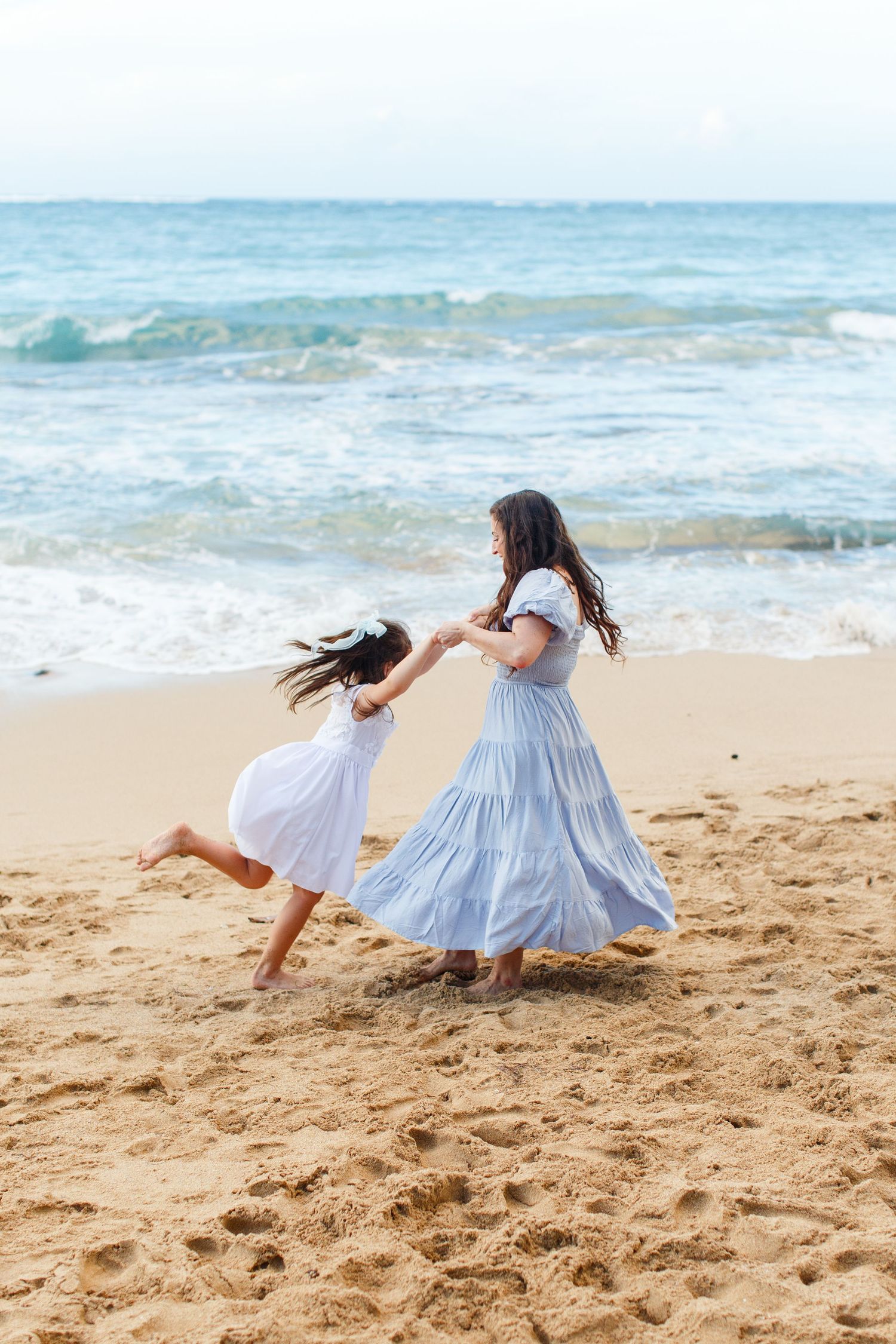 Portrait of a mother and daughter on the beach. San Juan, Puerto Rico.