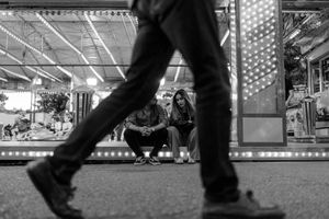 Cinematic engagement session under neon lights in Lisbon