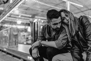 Cinematic engagement session under neon lights in Lisbon