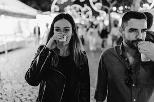 Cinematic photo of an engaged couple walking through Lisbon streets