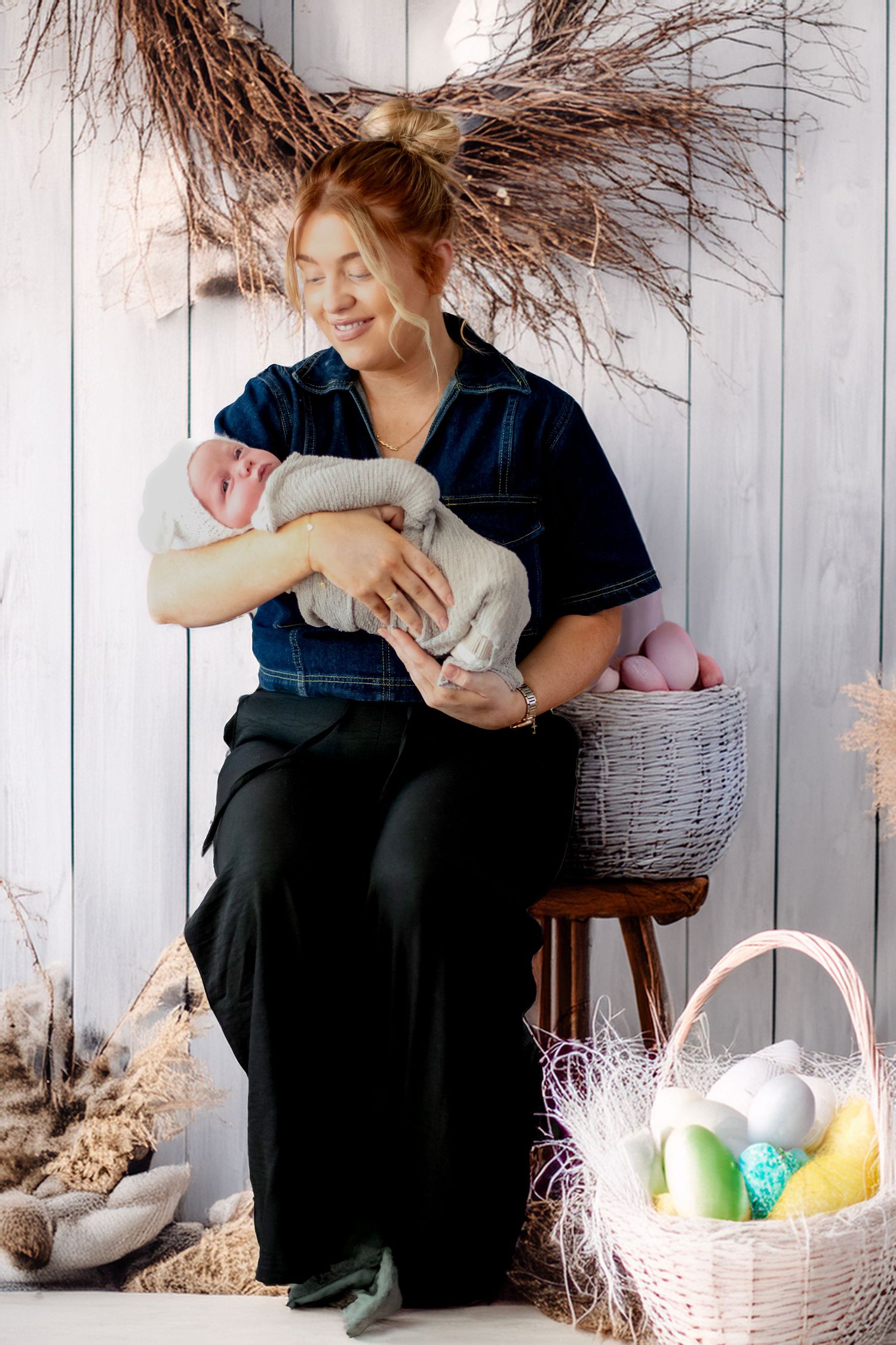 A tender moment with a baby at an Easter-themed photo session with rustic decor, dried pampas grass, and pastel baskets.
