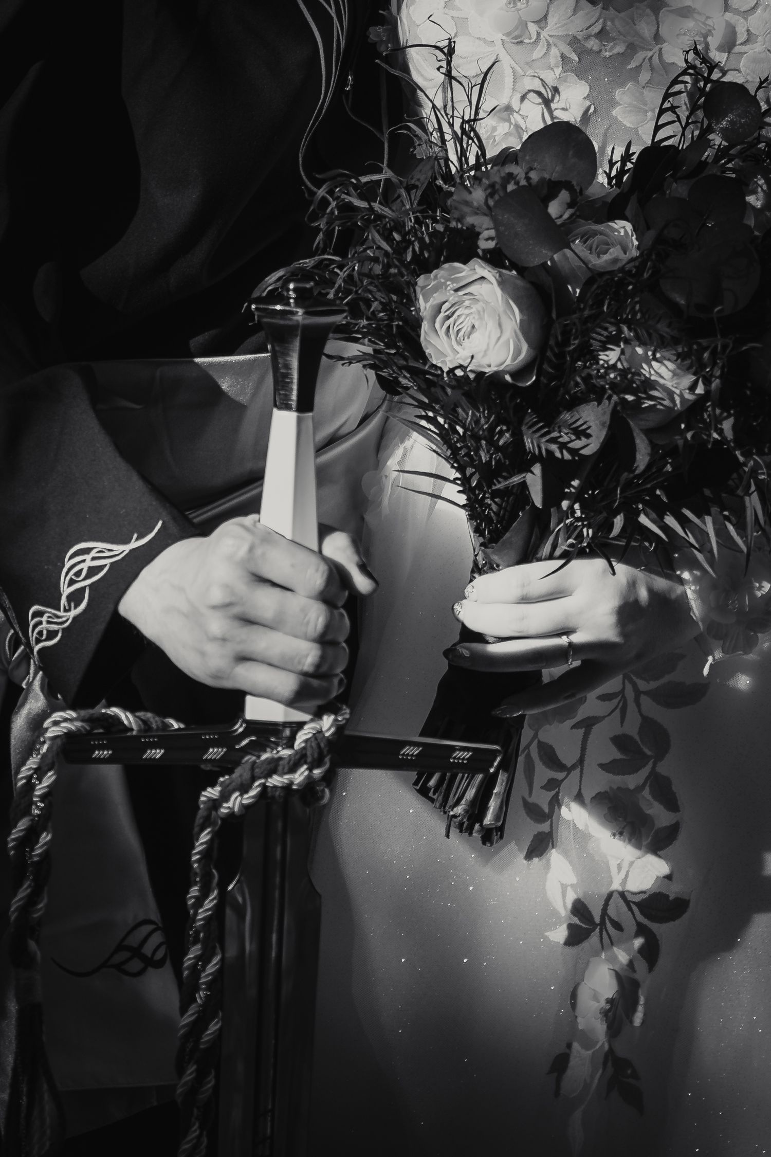 Black and white photo sequence showing hands holding a bridal bouquet with white roses and cascading greenery.
