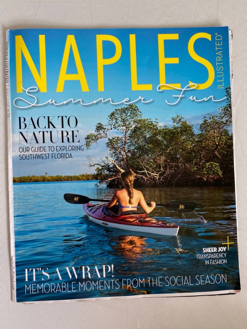 Naples Illustrated Summer Fun magazine cover featuring a woman kayaking through mangroves in Southwest Florida.