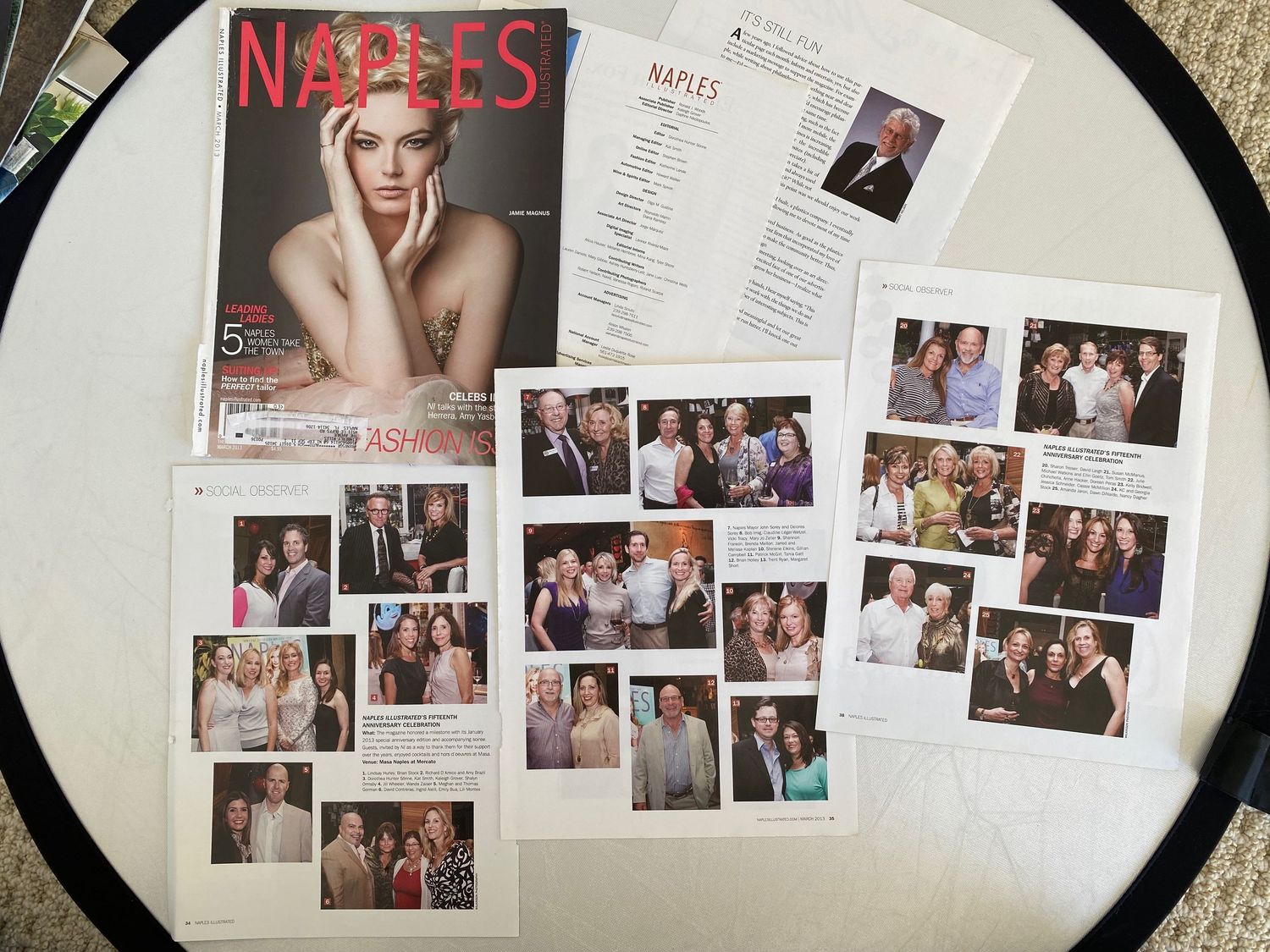 Naples Illustrated magazine displayed with loose social photography pages featuring event group portraits.