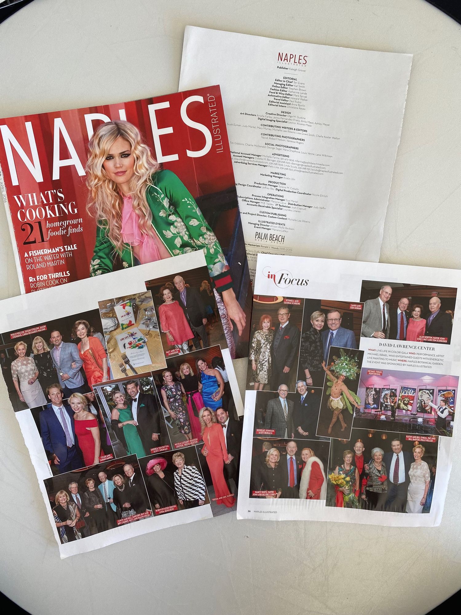 Naples Illustrated magazine with cover and loose editorial pages showing social event photography spreads.