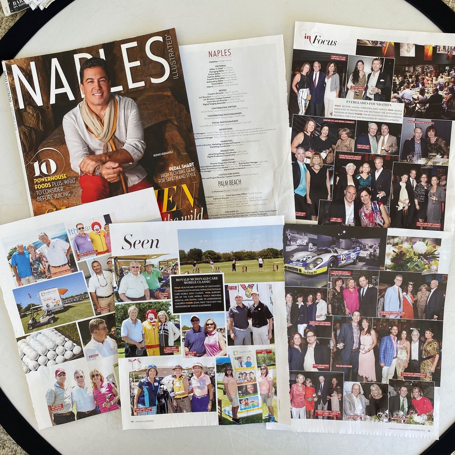 Naples Magazine issue featuring golf events and social gatherings with interior pages spread out.