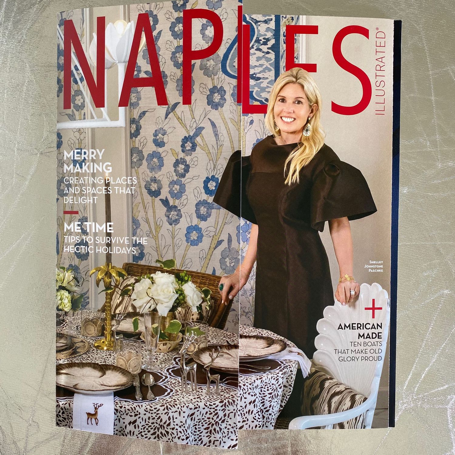 Naples Illustrated holiday issue featuring blonde woman in black dress beside festive table setting.