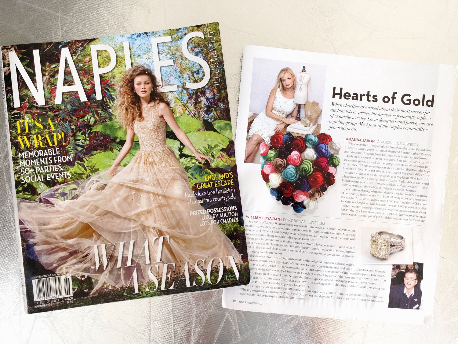Naples Illustrated magazine beside an open spread featuring a Hearts of Gold article with yarn heart.