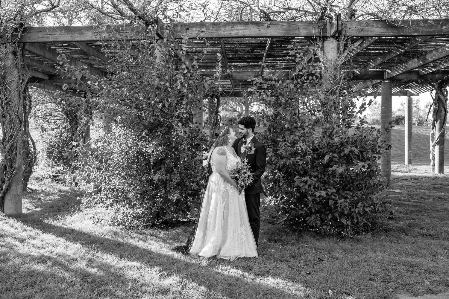 Couple in wedding attire at Winter Island in Salem, Massachusetts during their wedding photos.