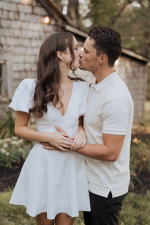 bride and groom kiss during wedding portraits at intimate micro-wedding in Moncton elopement photography New Brunswick photographer