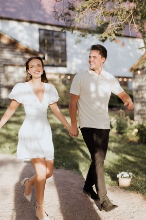 bride and groom walking hand in hand during intimate elopement in Memramcook, New Brunswick elopement photographer intimate micro-wedding