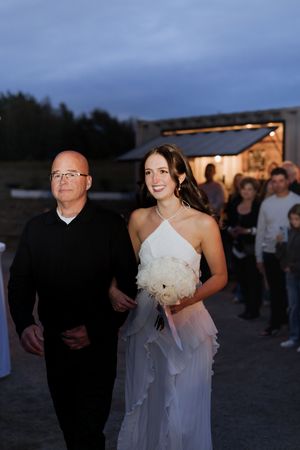 bride walks down the aisle in an surprise wedding outdoor elopement photography packages near me Moncton New Brunswick photographer