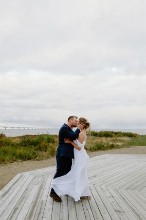 Couple's first kiss as husband and wife in romantic elopement wedding photography in Price Edward Island, Charlottetown photographer