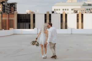 Couple walk hand in hand during romantic candid moment, New Brunswick elopement photography packages travel destination wedding photos