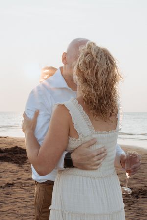 Couple slow dance on the beach at sunset in New Brunswick Canada wedding photography packages travel tourism wedding photographer Moncton NB
