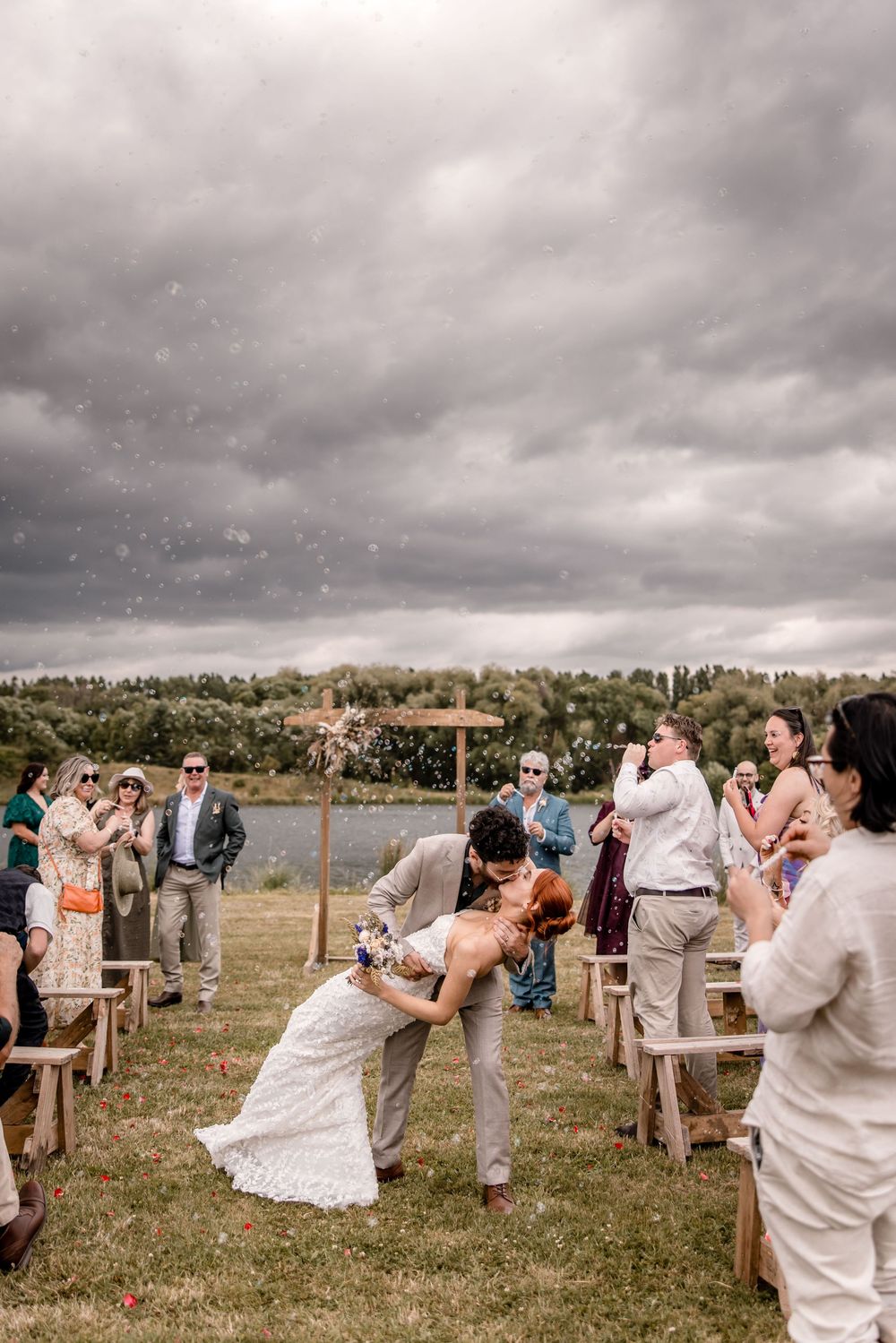 Bride and Groom Dip Kiss at Back Paddock Lakes ceremony, Hawkes Bay