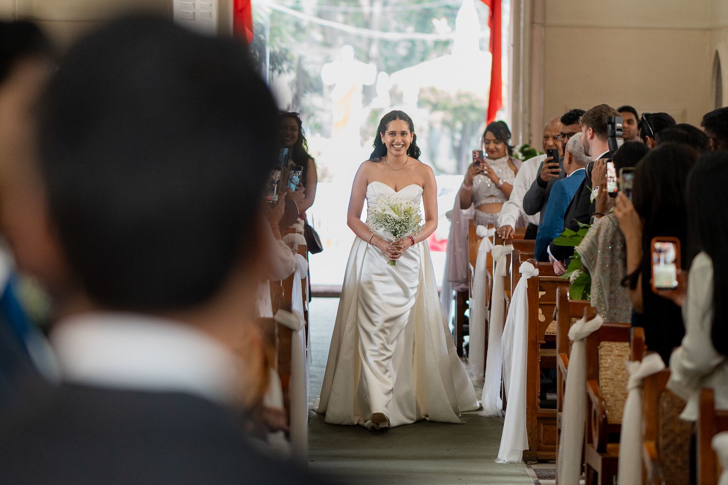 A sequence of candid wedding moments captured in a series of five photos showing guests and ceremony details.