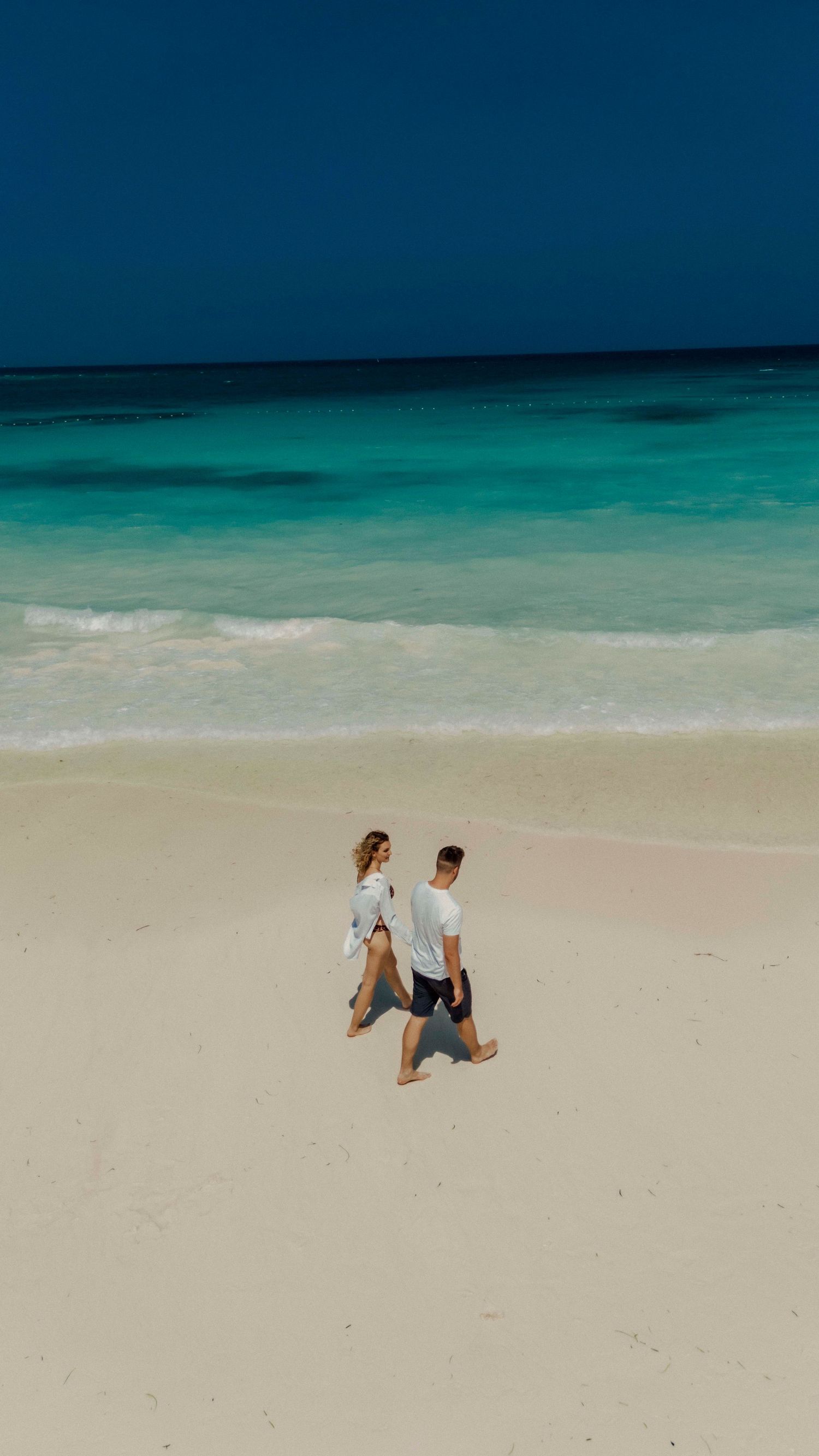 Couple enjoying ocean view Nungwi Zanzibar