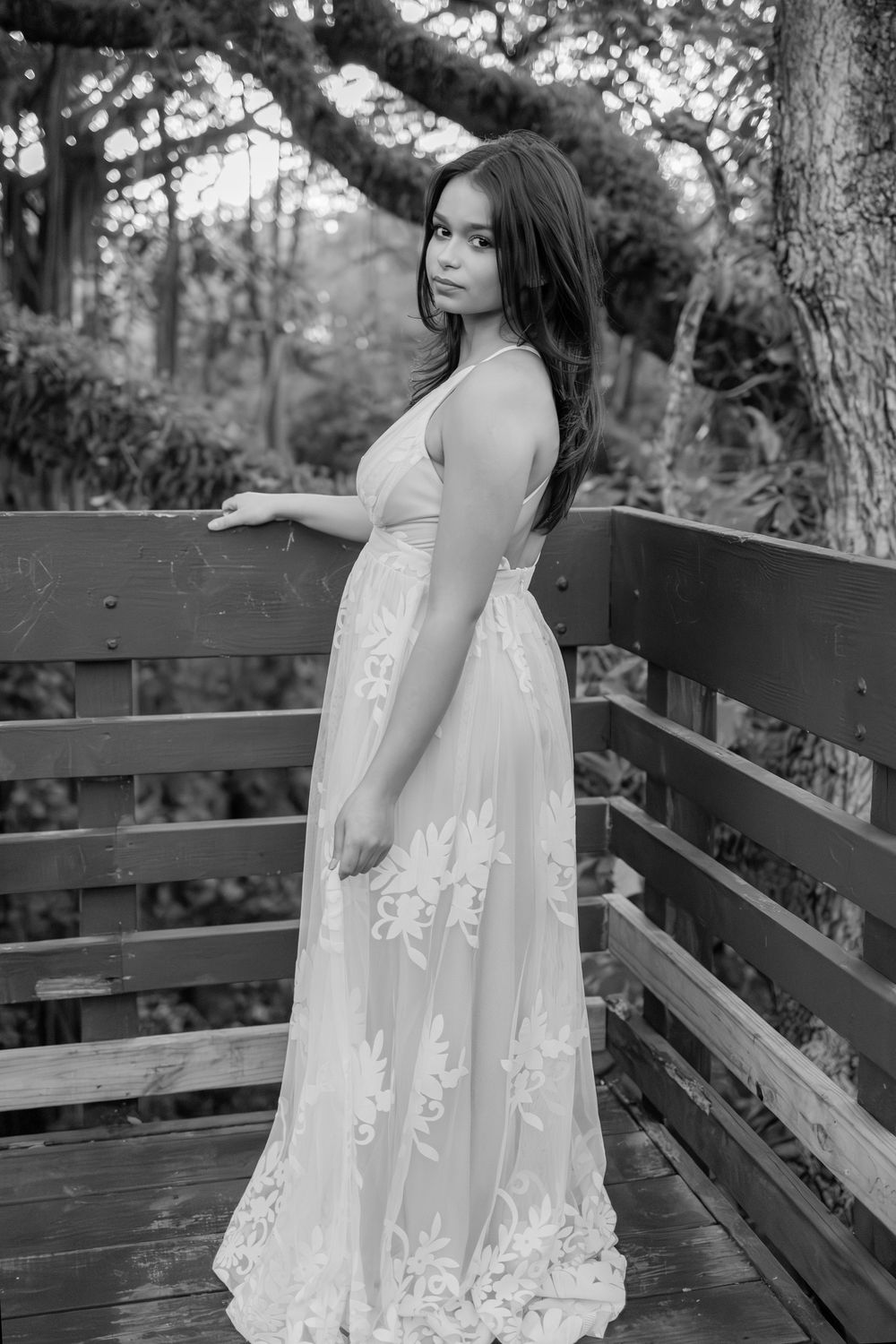 senior portrait with lace dress at tree tops park in davie showing off back of dress