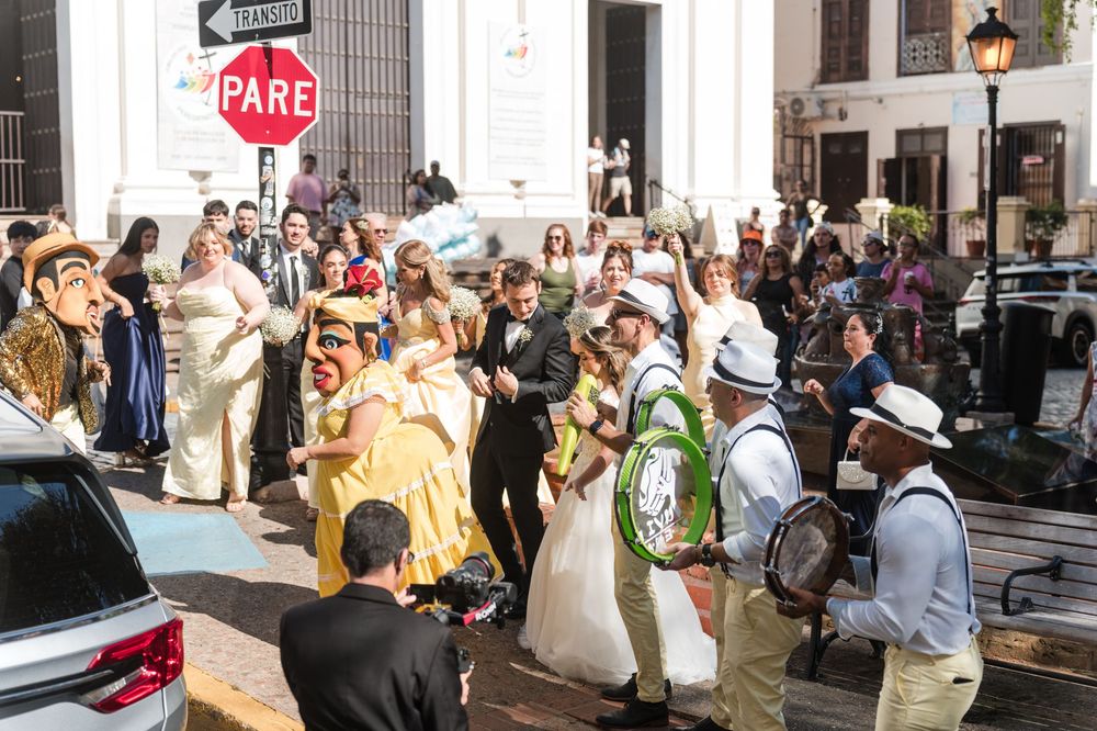 Wedding guests and live band filling street during plena parade in Old San Juan Puerto Rico