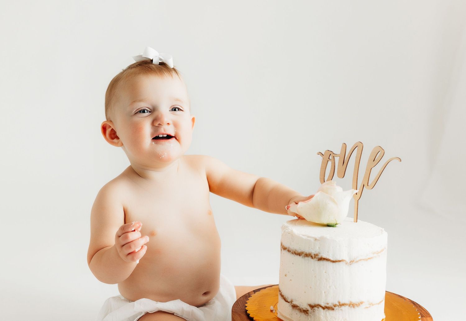 Girl enjoying her cake. Greenville sc newborn photographer, Easley sc newborn photographer, Upstate newborn photographer.