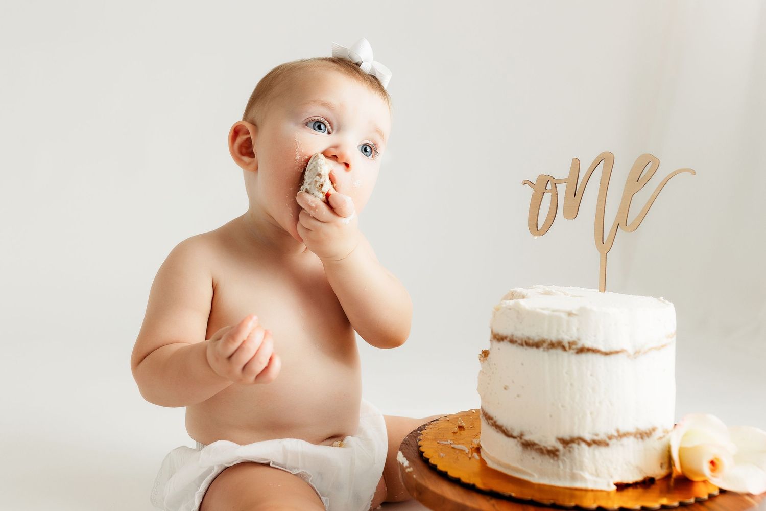 1 year old enjoying her cake. Greenville sc newborn photographer, Easley sc newborn photographer, Upstate newborn photographer.