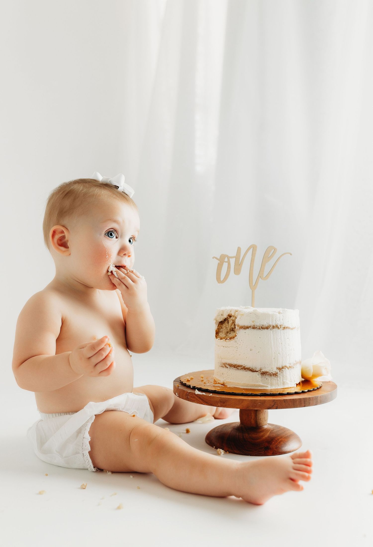 Baby girl eating cake. Greenville sc newborn photographer, Easley sc newborn photographer, Upstate newborn photographer.