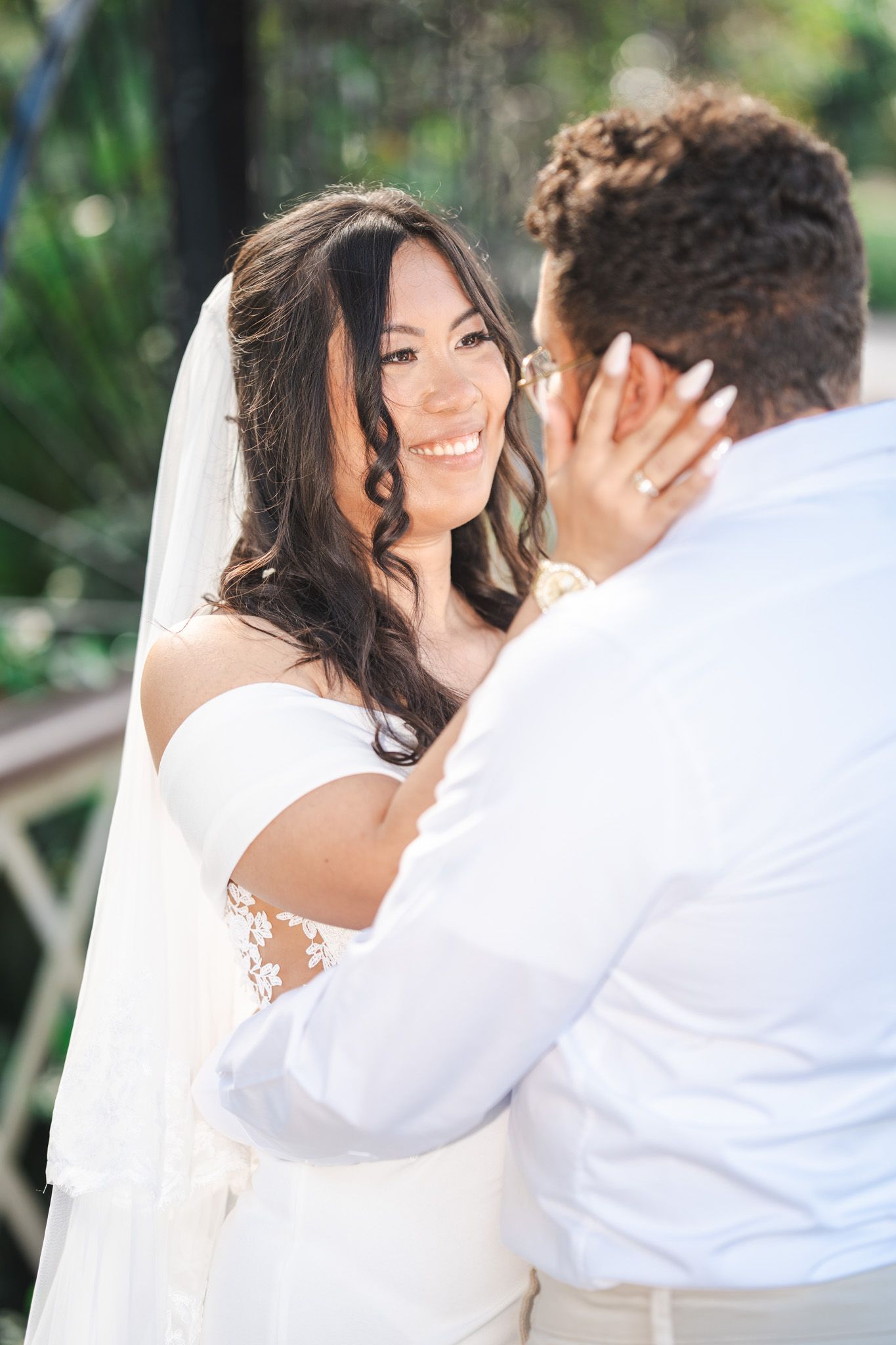 Wedding Couple embrace in Botanical Gardens Gibraltar