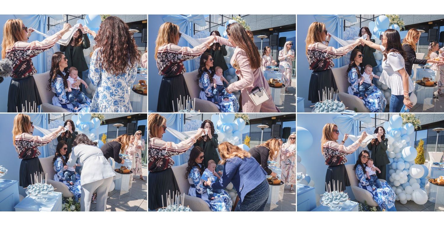 Wedding guests enjoying a festive outdoor reception with blue and white themed decorations.