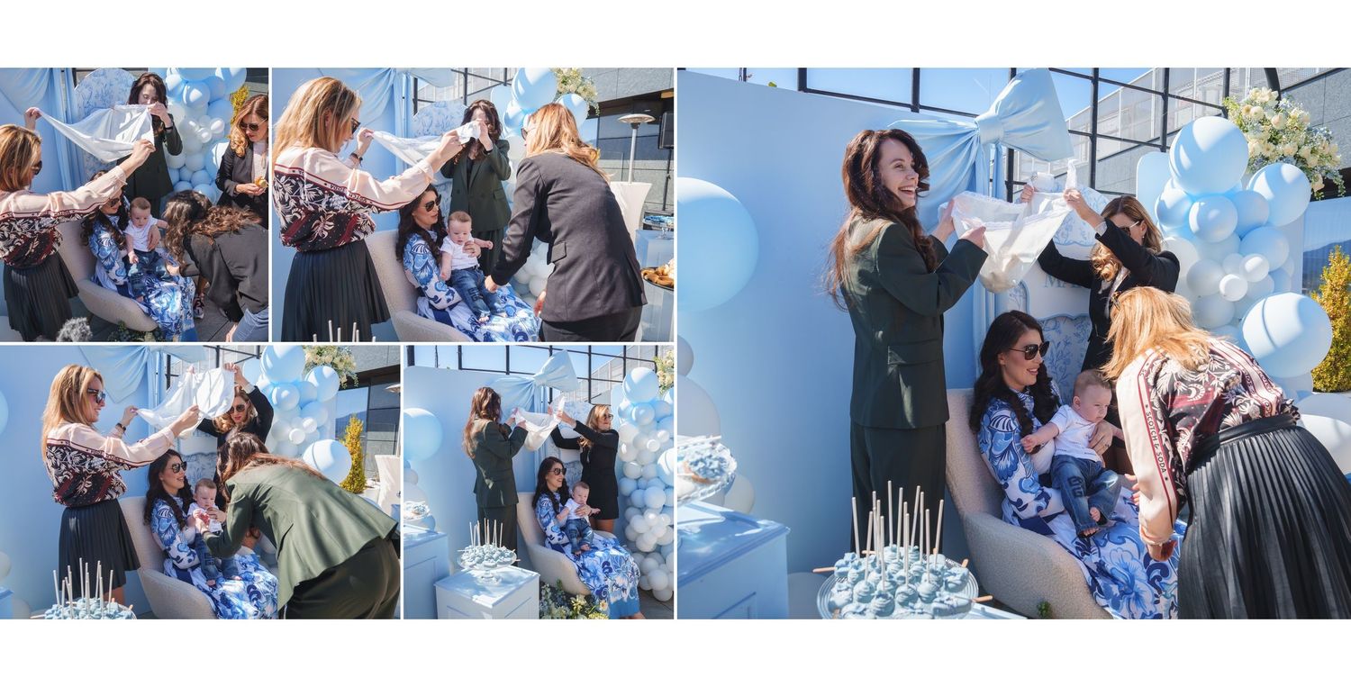 A group gathers outdoors for a social event wearing blue and white casual attire on a sunny day.