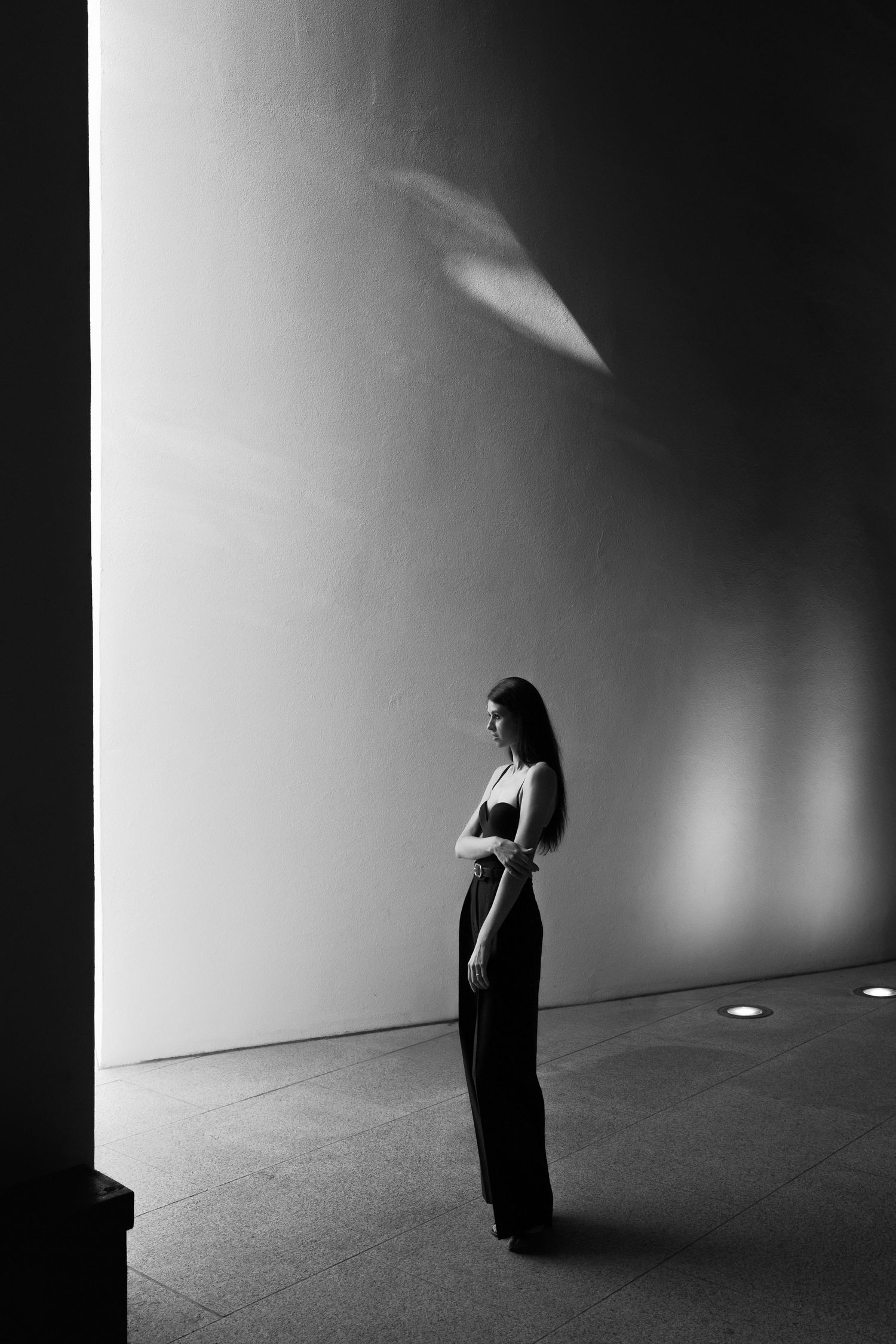 A dramatic black and white photo series showing a silhouetted figure against stark minimalist backgrounds.