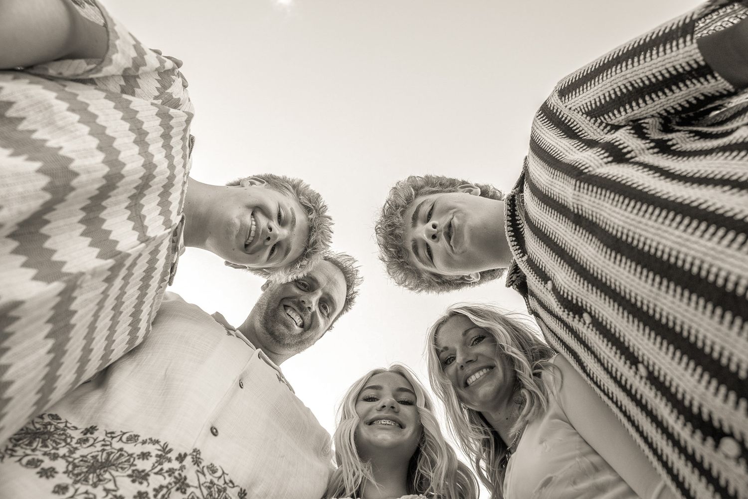 Black and white photo sequence showing a playful interaction between two people in a fun, candid moment.