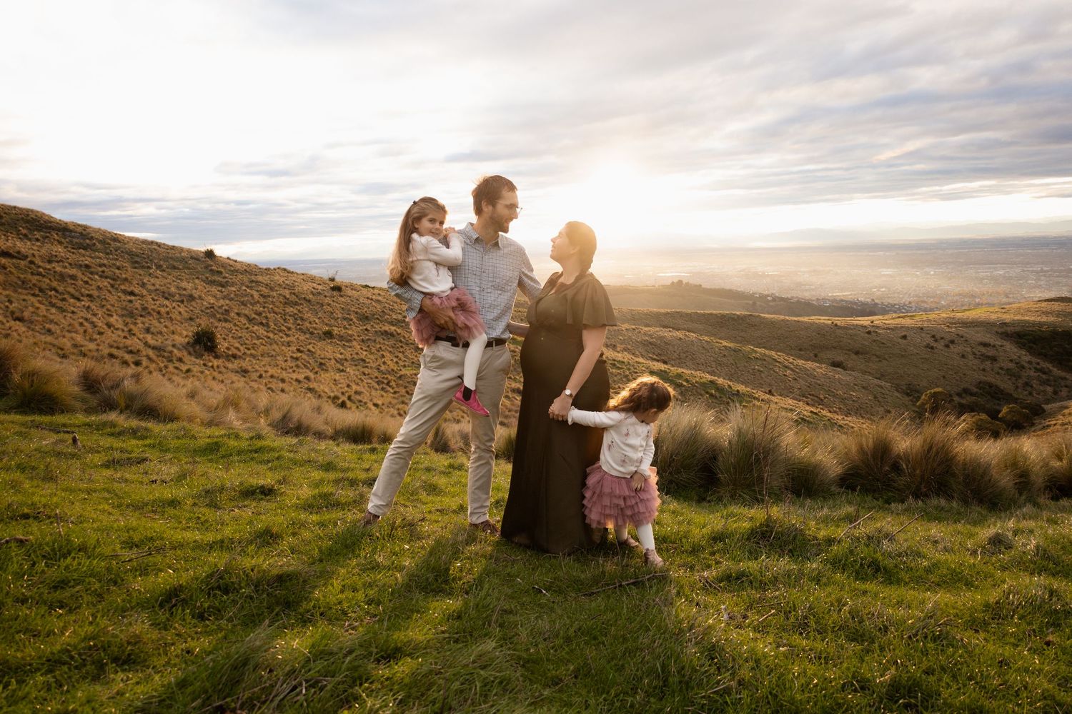 Family playing at maternity session in Christchurch