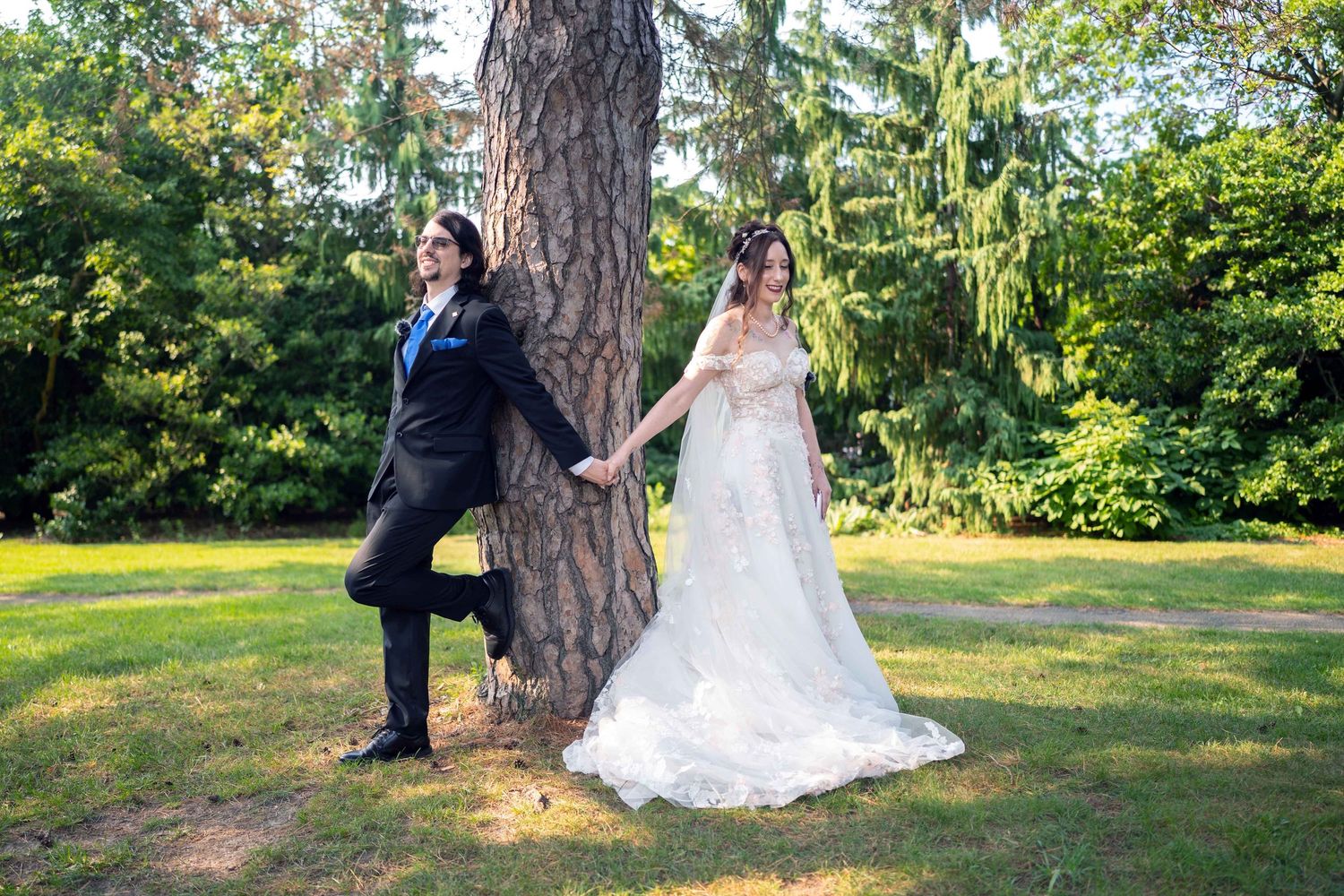 Bride and groom first touch in Toledo Zoo Wedding Venue