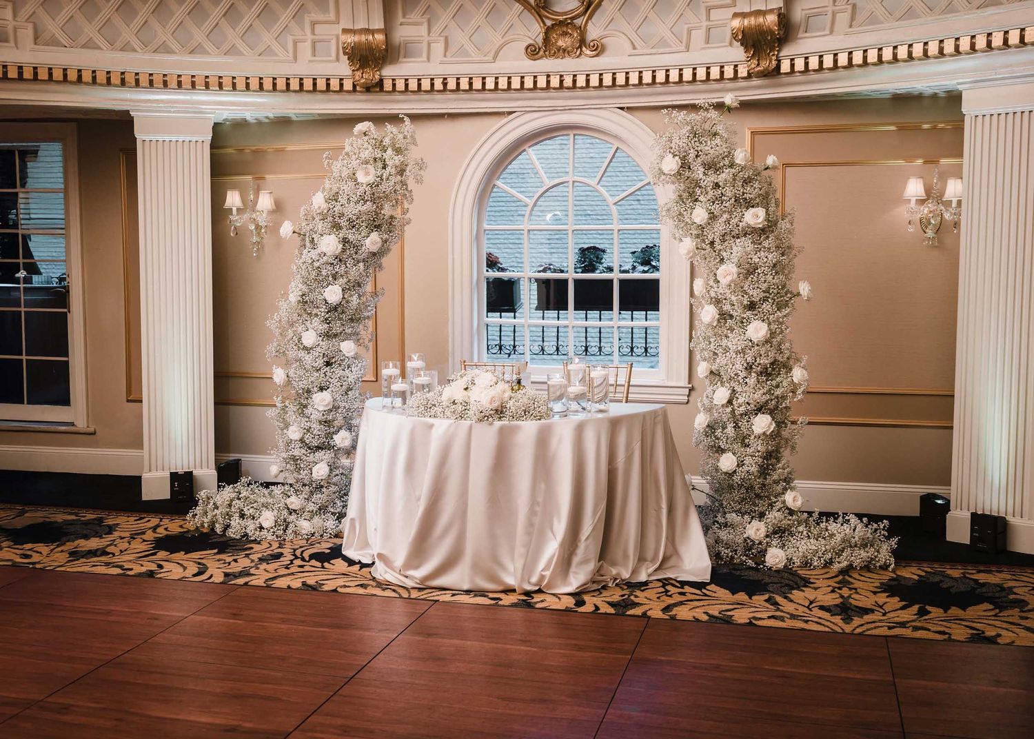 Lenox Hotel Boston Dome Room wedding reception decor with floral installation and elegant table design