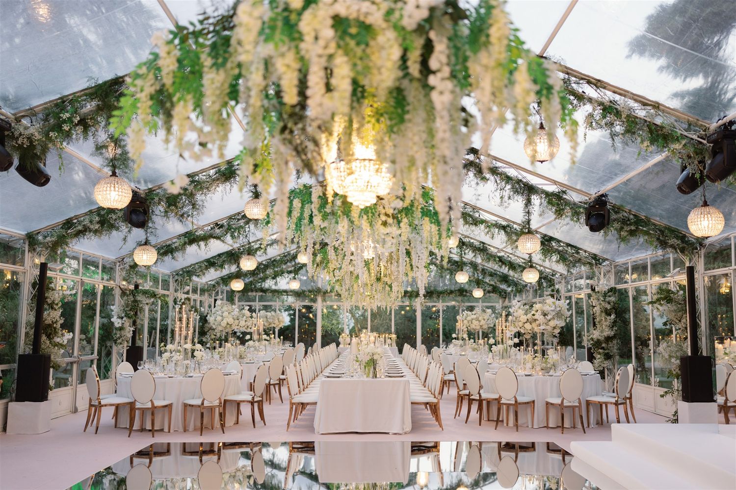 Luxury destination wedding reception on Isola del Garda with floral design in white, blush and gol