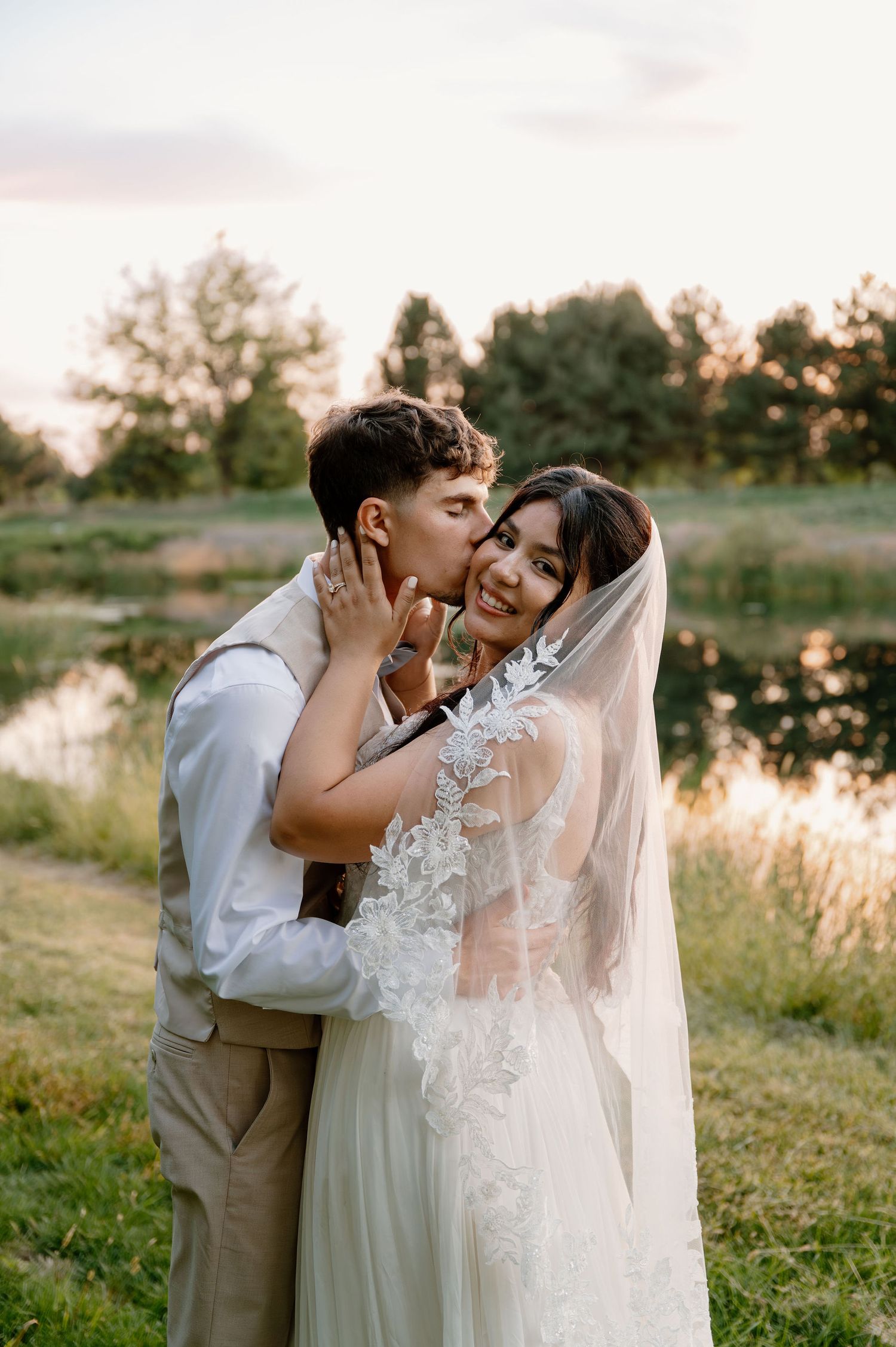 Outdoor wedding portraits near a pond in Oregon at sunset