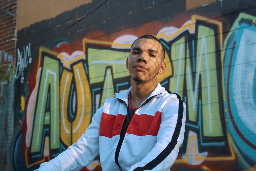 A model in front of a graffiti wall