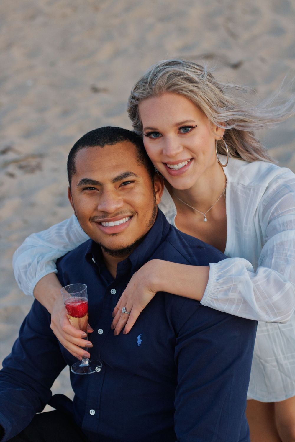 A couple posing happily