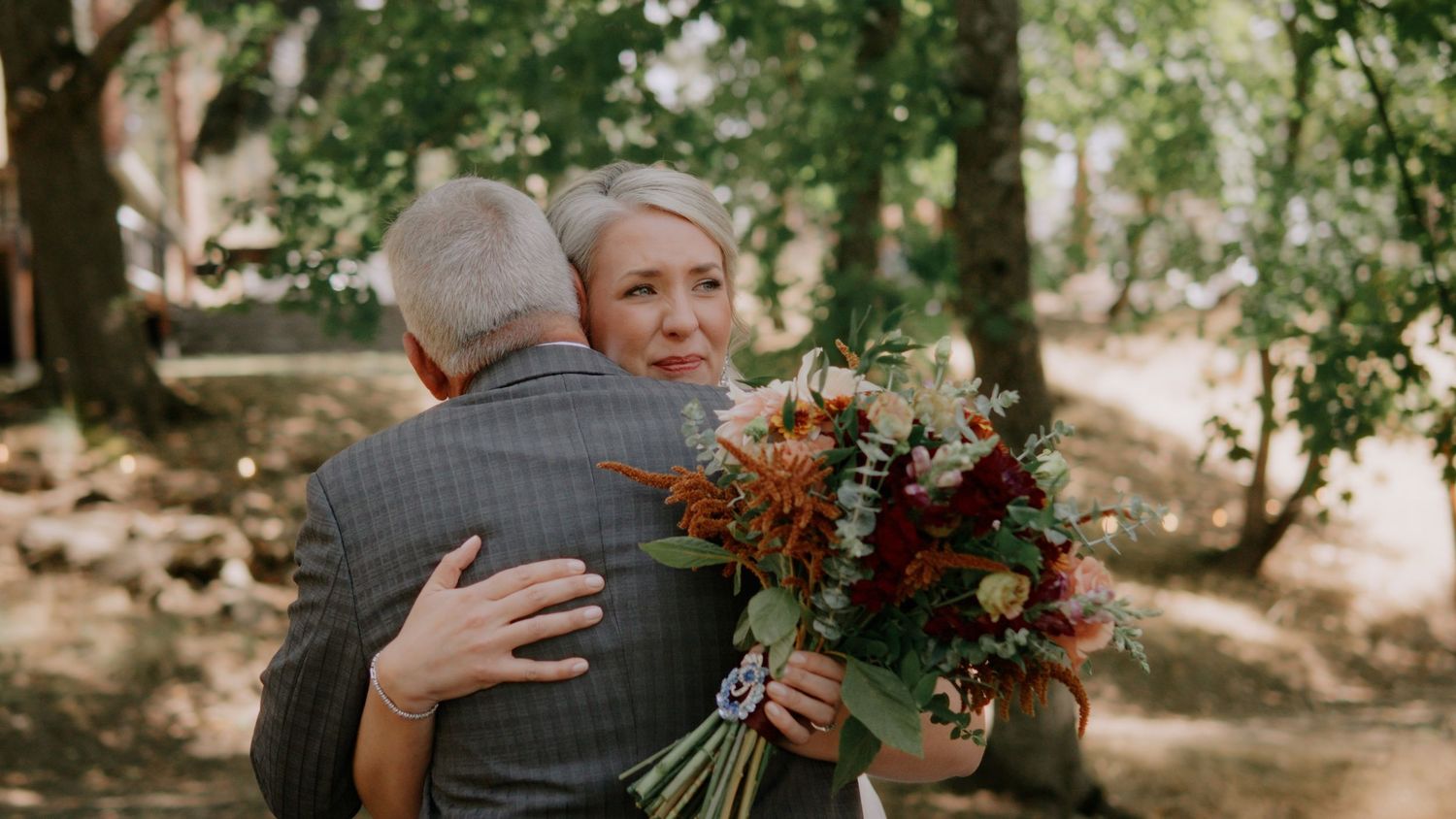 A romantic outdoor wedding moment captured in a series of intimate embraces and floral bouquets.