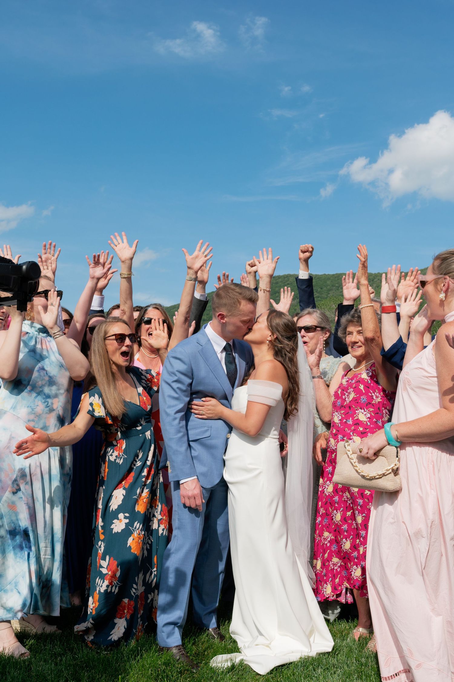A sequence of photos showing emotional moments between a bride in a white dress and an older woman during wedding preparations.