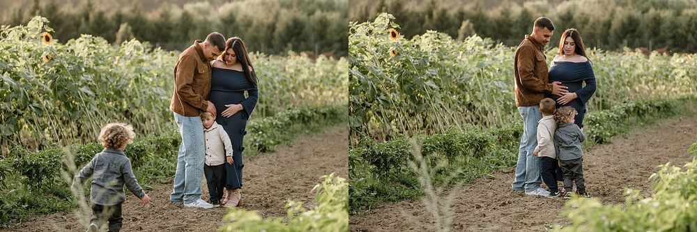 A couple walks together on a dirt trail surrounded by lush greenery and wildflowers on a sunny day.