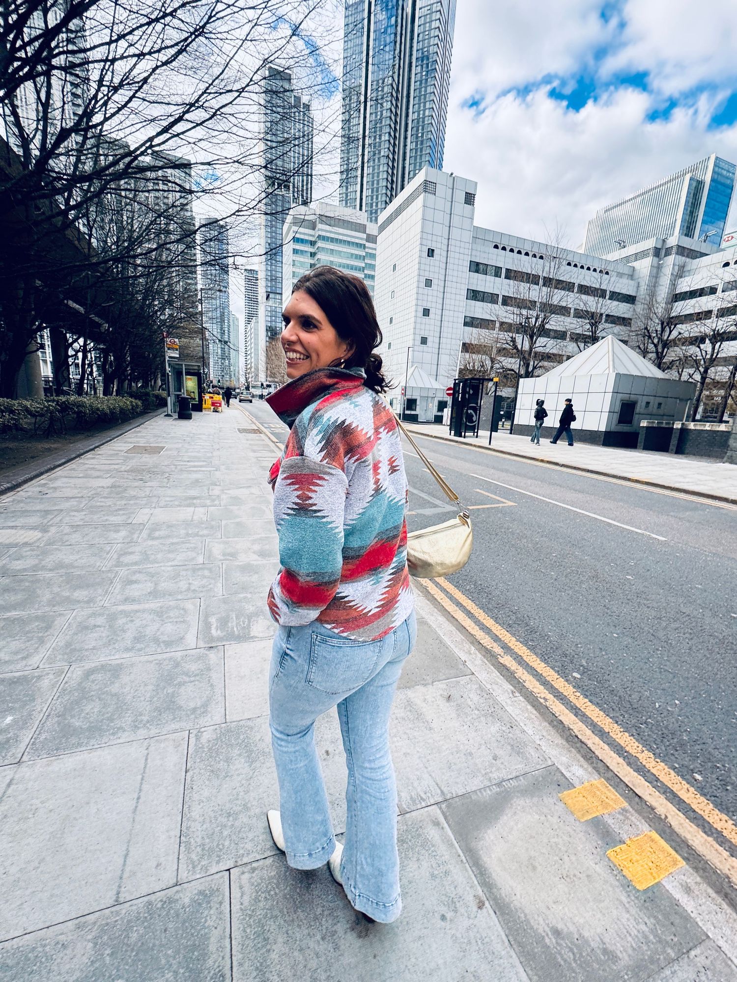 woman walking in urban road setting in printed jacket for dating photographer