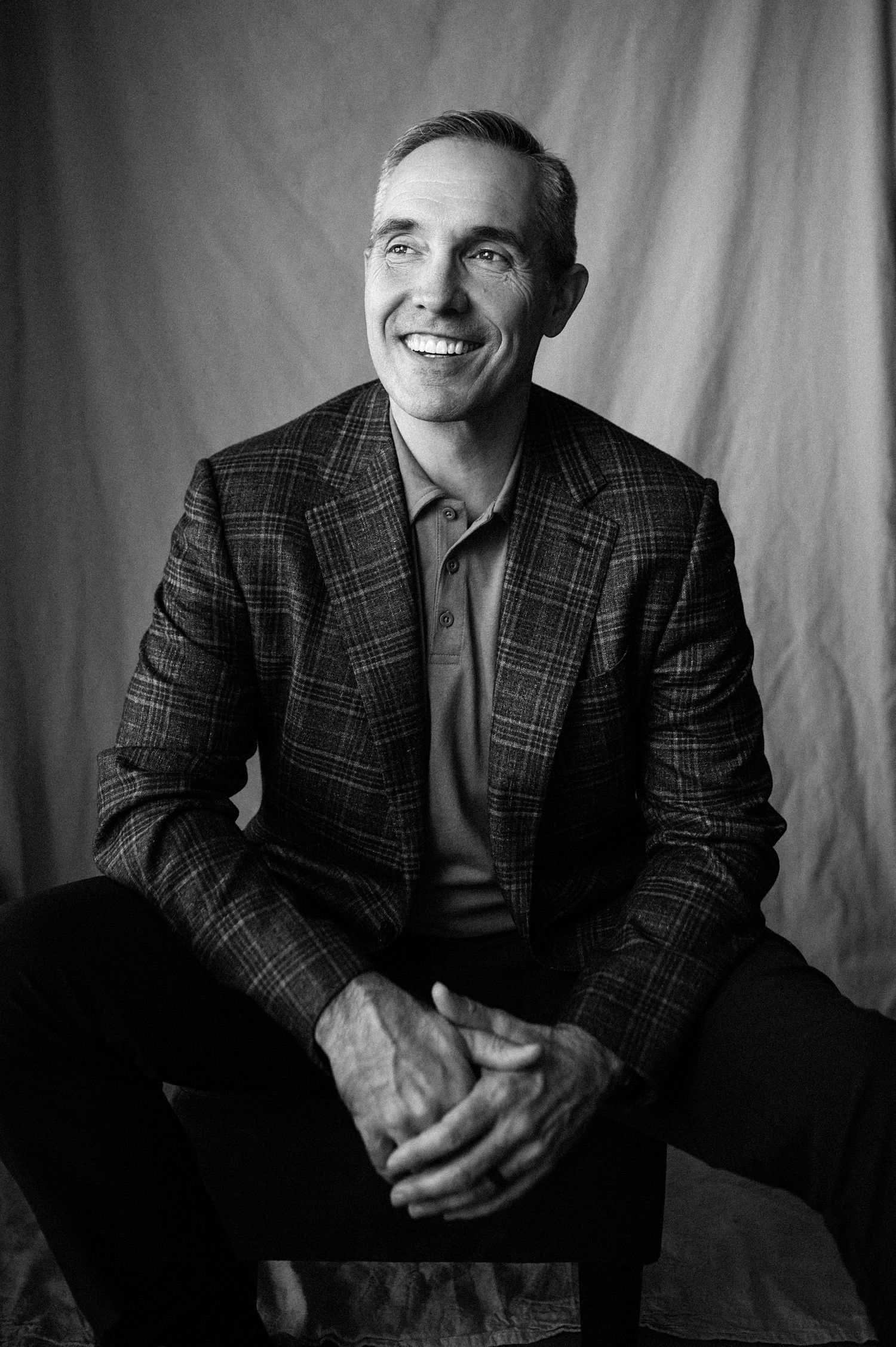 Black and white headshot of male in a suit. Photographer in Salt Lake City and Ogden Utah. Creative and powerful posing to build confidence